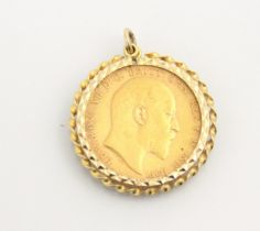 An Edward VII full sovereign, dated 1903, within a yellow metal pendant mount with rope twist