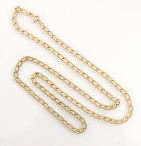 A yellow metal necklace, the oval curb link chain with grooved detail to each side, with bolt ring