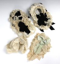 Three mid Victorian indoor bonnets, comprising; two ivory lace and black velvet examples and a cream