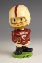 A vintage 1960s Cornell football bobble head, circa 1962, modelled in the 'Baggy shirt toes up'
