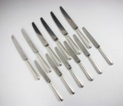 A near set of six silver handled table knives, Garrard and Co, London 1961-62, the handles with