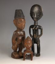 A West African Nigerian Yoruba Ibeji doll, 26.5cm high, with a Ghana Ashanti black painted female