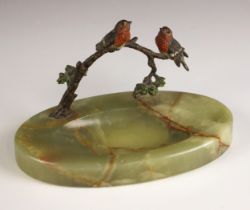 An Art Deco cold painted bronze and onyx ashtray, modelled with birds perched upon a branch atop