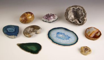 A group of nine geodes and polished minerals examples, including a rock crystal quartz geode, 12cm