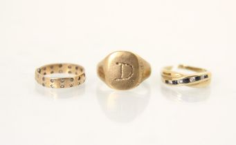 A selection of three yellow metal and gold coloured rings, including a 9ct yellow gold signet