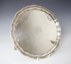 A George V silver salver, Selfridge and Co Ltd, Birmingham 1924, the shaped rim above plain polished