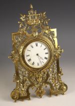 A brass easel timepiece, late 19th/early 20th century, the 9cm white enamelled dial (some cracks),
