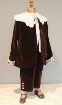 A late Victorian childs assembled costume of brown velvet, with lace collar and cuffs, the