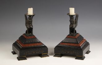 A pair of Egyptian revival patinated bronze, polished slate and rouge marble candle sconces, late