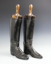 A pair of early 20th century black leather ladies riding boots, with boot trees, sole 25cm long (2)