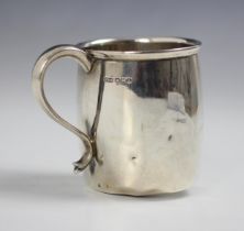 A silver mug, James Dixon and Sons, Sheffield 1947, the slightly flared rim above plain polished