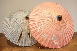 Two Japanese painted parasols, early 20th century, with an Edwardian root wood handled parasol (