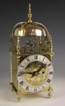 An eight day single fusee brass lantern form clock, retailed by Goldsmiths & Silversmiths, 112