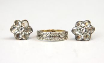 A diamond set double half eternity ring, the rows of round cut stones set within spitch set white