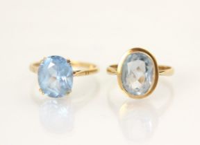 A 9ct yellow gold blue paste ring, the oval cut blue stone within a rub over yellow gold mount