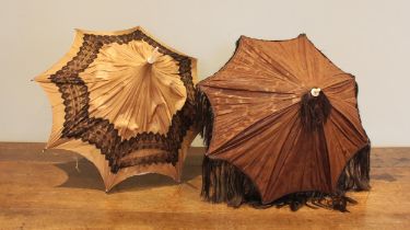 A mid Victorian pagoda parasol, with brown silk mount applied with black bobbin lace trim, lined