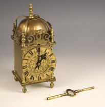 A brass lantern form mantel clock, retailed by Mappin & Webb, London, early 20th century, with
