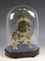 A Victorian brass eight day fusee skeleton clock, the 11cm silvered and scalloped bezel applied with