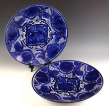 A pair of Japanese porcelain blue and white chargers, 19th century, each of large circular