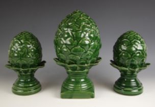 A set of three decorative green-glazed pottery pineapple finials, 20th century, 24cm high to 30cm