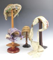 A 19th century natural straw work ladies bonnet, possibly French, together with a further ladies
