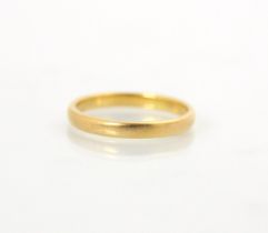 A 22ct yellow gold wedding band, stamped 'DTN' Birmingham 1991, ring size Q 1/2, 3.9gms