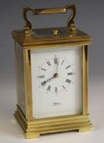 A brass cased eight day repeating carriage clock, retailed by Waltons, Chester and Wrexham, late
