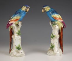 A pair of Samson porcelain parrots, 20th century, each realistically modelled upon naturalistic