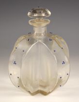 A glass cruciform decanter and stopper, late 19th/ early 20th century, the body decorated with