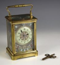 A brass cased two train repeating carriage clock, late 19th century, the 7cm enamel dial with engine