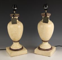 A pair of Oka 'Gela' wooden table lamps, of vase form, painted in ivory shades with brown detail,