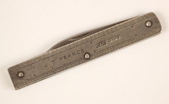 A novelty pen knife, Cohen and Charles, Sheffield 1957, modelled as a ruler with engraved 'JT