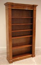 A burr elm veneered open bookcase, in the Georgian style, late 20th century, with a moulded and