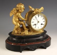 A French gilt metal and slate figural mantel clock, mid to late 19th century, the drum type clock