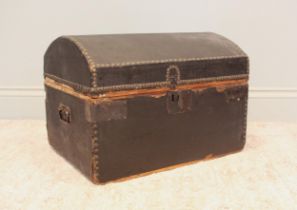 An early Victorian leather bound and studded carriage box, of rectangular form with domed cover