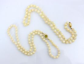 A string of cultured pearls, the seventy one uniform pearls with a 9ct yellow gold clasp set with