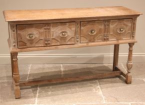 A Jacobean revival limed oak dresser/sideboard, late 19th century, the moulded top over two