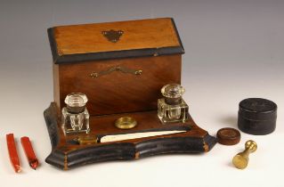 A Victorian desk stand, late 19th century, comprising a mahogany stationery box with hinged cover