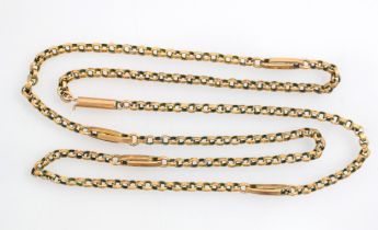 A yellow metal necklace, the trace link chain with four interlocking oval links, with barrel clasp