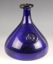 A Holmegaard glass carafe, 20th century, in the Ole Winther design, the cobalt body with Viking face