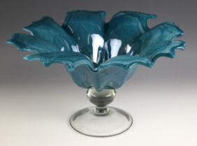 A studio glass bowl, 20th century, modelled as a flower, the teal bowl leading to a clear glass