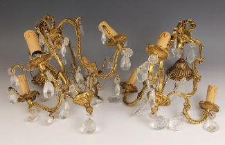 A French gilt-metal three branch chandelier, 20th century, with scroll branches and cut glass