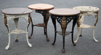 Four cast iron Britannia pub tables, each with a circular hardwood top upon relief cast supports (4)
