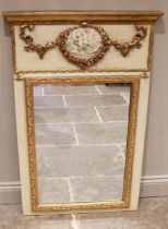 A Louis XVI style painted and gilt embellished pier mirror, late 20th century, the upper frieze