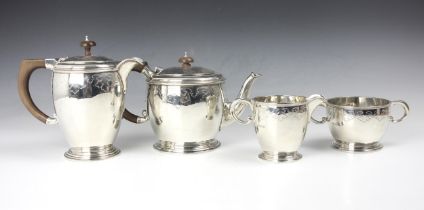 A George V silver four piece tea service, Wakely and Wheeler, London 1930, comprising hot water jug,
