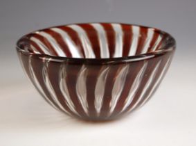 An Orrefors 'Ariel' glass bowl by Edvin Ohrstrom, formed from ruby glass with pulled bubble