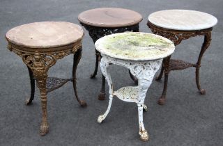 Four cast iron Britannia pub tables, each with a circular hardwood top upon relief cast supports (4)