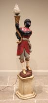 A painted composite figural standard lamp, early 20th century, modelled as a blackamoor wearing a