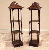 A pair of Chinese Chippendale style mahogany wall shelves, 20th century, each with a pagoda style