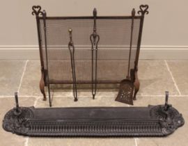 A 19th century iron fire kerb, the pierced front gallery extending to cast scrolling foliate